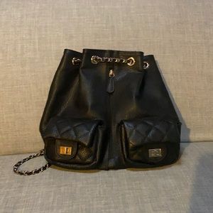 Quilted black faux leather backpack with chain straps